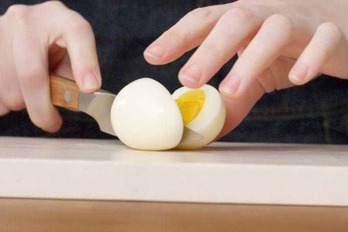 cutting a hard boiled egg in half