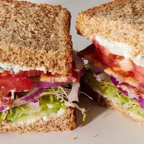 Delicious tomato and cucumber sandwich on whole grain bread