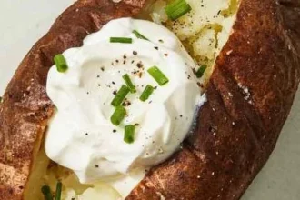 Air fryer baked potato served with toppings