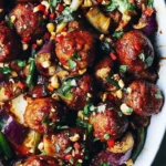 Delicious Asian-inspired eggplant casserole served in a bowl with toppings.