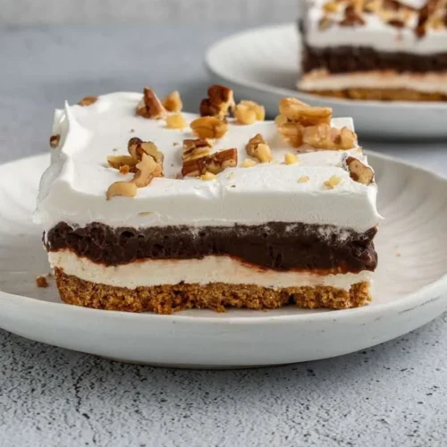 Creamy chocolate pudding dessert in a glass topped with chocolate shavings