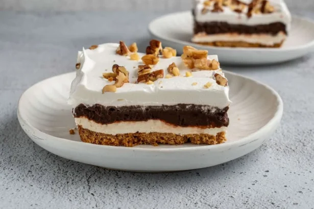 Creamy chocolate pudding dessert in a glass topped with chocolate shavings