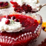 A colorful serving of Cranberry Jello Salad with cranberries and nuts