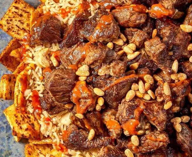 Delicious Egyptian Beef served with Pita bread and Rice
