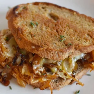 Delicious French Onion Soup Grilled Cheese Sandwich with melted cheese and onions