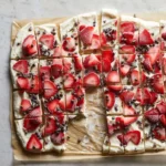 Delicious frozen yogurt bark topped with fruit and nuts