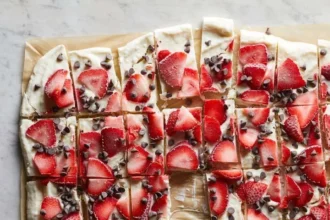 Delicious frozen yogurt bark topped with fruit and nuts