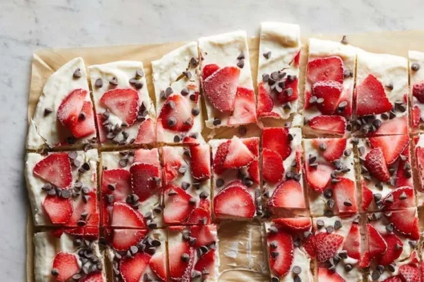 Delicious frozen yogurt bark topped with fruit and nuts