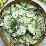 German cucumber salad with fresh ingredients in a bowl
