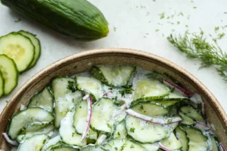 German cucumber salad with fresh ingredients in a bowl