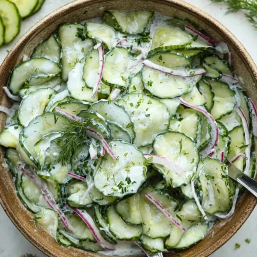 German cucumber salad with fresh ingredients in a bowl