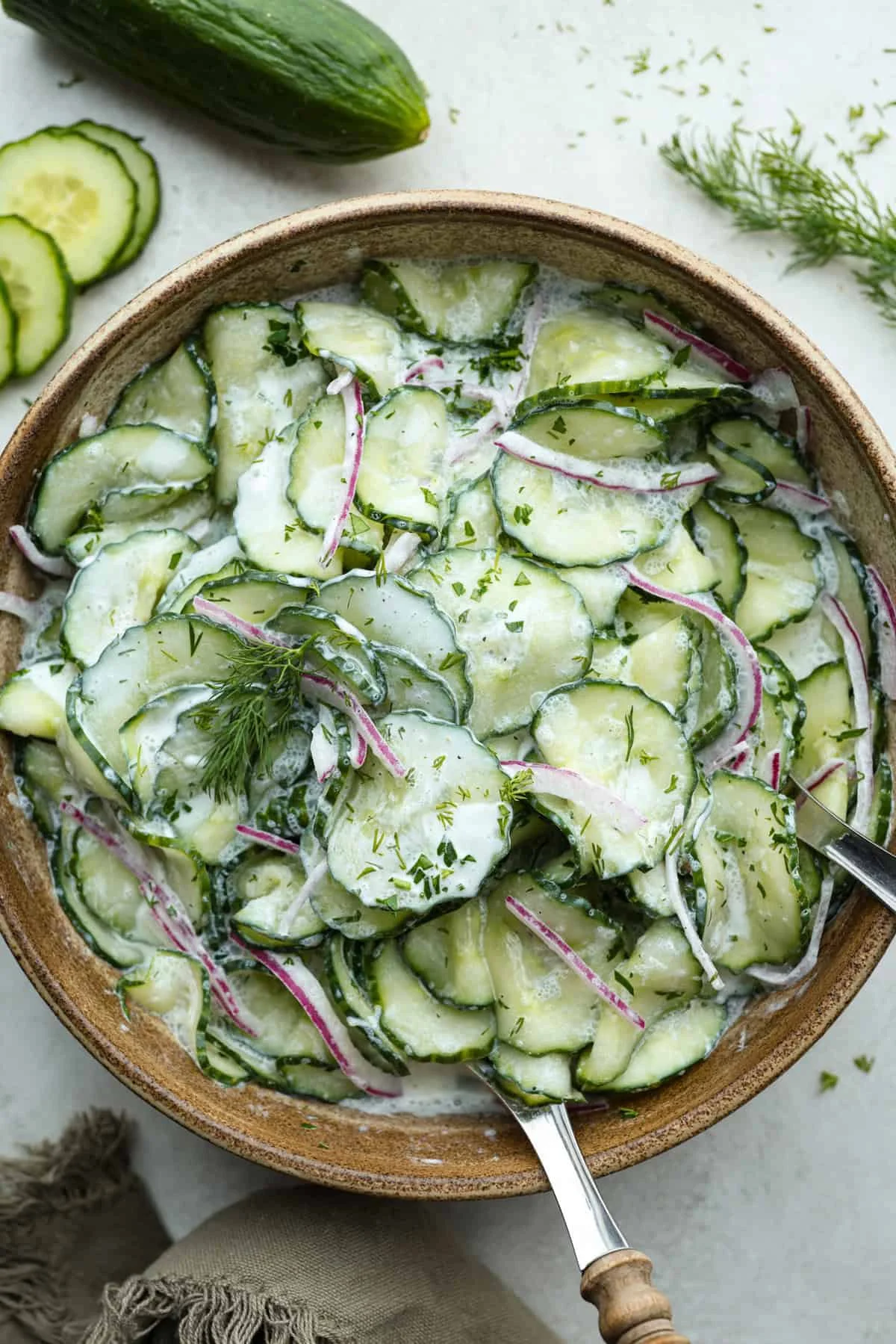 German cucumber salad with fresh ingredients in a bowl