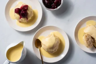 Delicious German yeast dumplings served with a creamy sauce