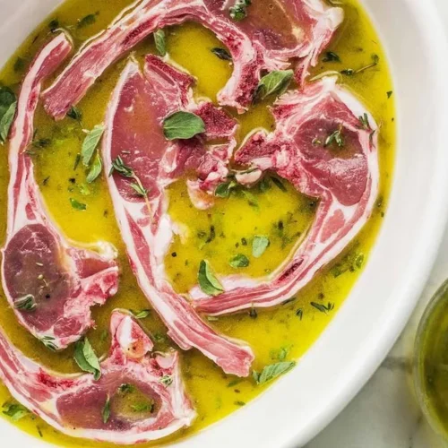 Bowl of Greek Style Marinade with herbs and spices for grilling meats.