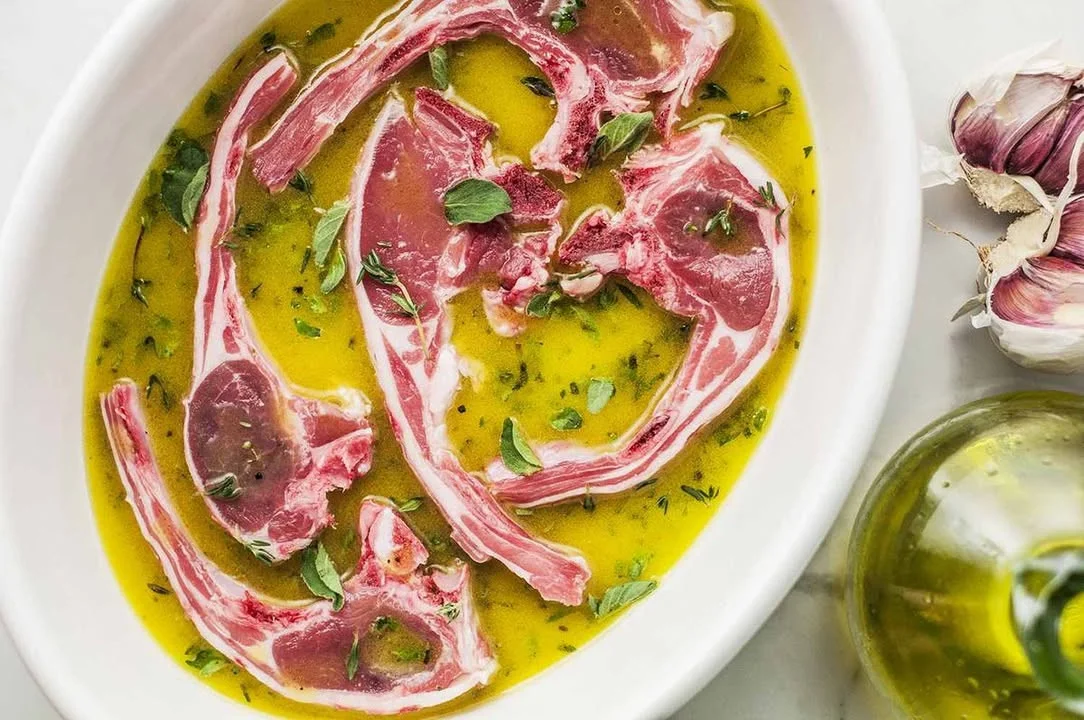 Bowl of Greek Style Marinade with herbs and spices for grilling meats.
