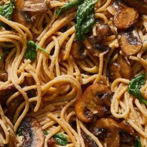 Delicious Mushroom and Spinach Pasta served in a bowl with fresh ingredients