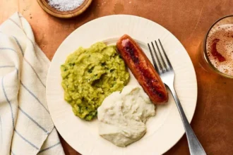 Bowl of creamy mushy peas served as a side dish.
