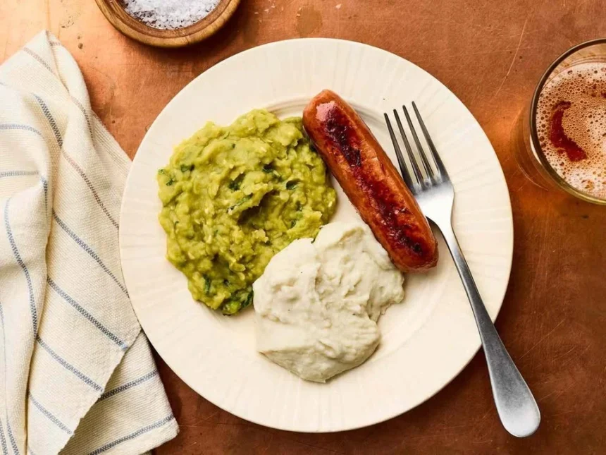 Bowl of creamy mushy peas served as a side dish.