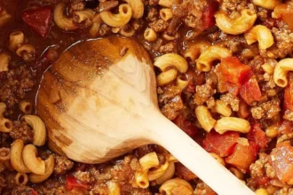 Bowl of old-fashioned goulash with pasta and ground beef