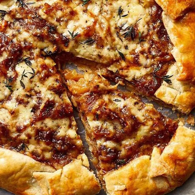 Home-baked onion galette with caramelized onions and pastry crust