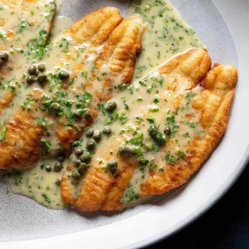 Pan-fried fish fillets served with a lemon-butter sauce