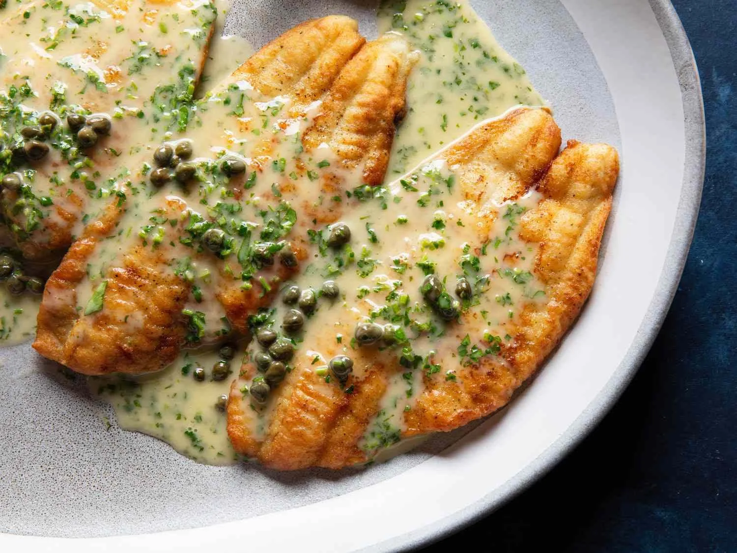 Pan-fried fish fillets served with a lemon-butter sauce