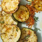 Parmesan-and-herb-crusted zucchini baked to golden perfection.