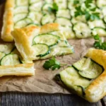 Flaky layers of puff pastry used in various dishes like appetizers, mains, and desserts