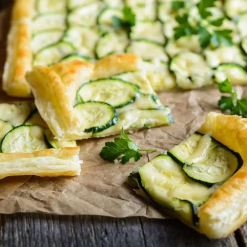 Flaky layers of puff pastry used in various dishes like appetizers, mains, and desserts