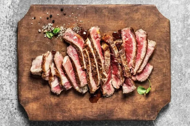 Delicious spicy Indian beef steak served with vibrant spices and herbs.