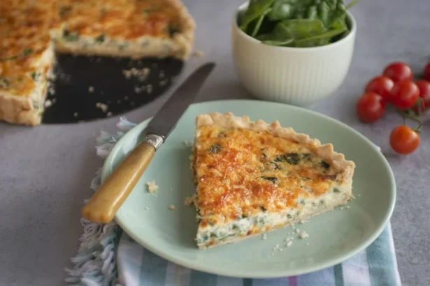 Delicious homemade Spinach Quiche with a flaky crust and fresh spinach