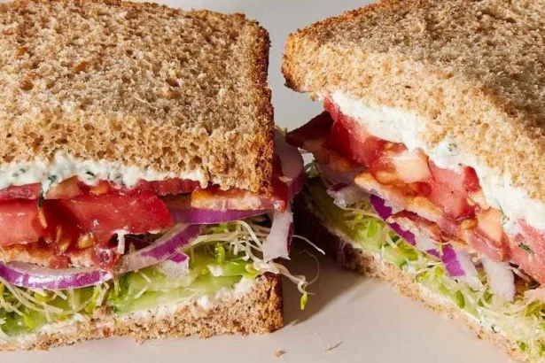 Delicious Tomato Cucumber Sandwich on a plate with fresh ingredients