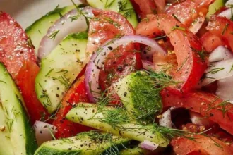 A colorful Tomato-Cucumber Salad featuring fresh tomatoes and cucumbers.