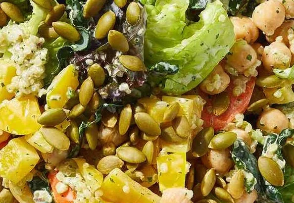 Vegetarian chopped power salad with creamy cilantro dressing and colorful veggies