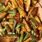 Fresh zucchini stir-fry with colorful vegetables in a skillet