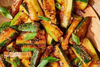 Fresh zucchini stir-fry with colorful vegetables in a skillet
