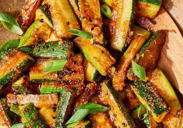 Fresh zucchini stir-fry with colorful vegetables in a skillet