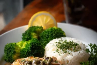 Creamy herb-mushroom chicken dish served with rice and broccoli