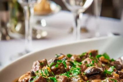 Delicious creamy ostrich and mushroom stew served in a bowl