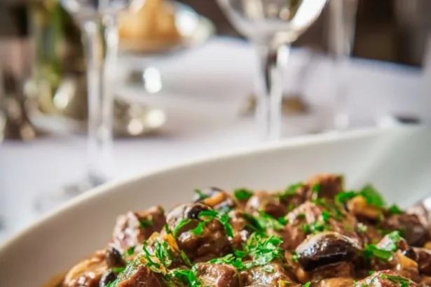 Delicious creamy ostrich and mushroom stew served in a bowl