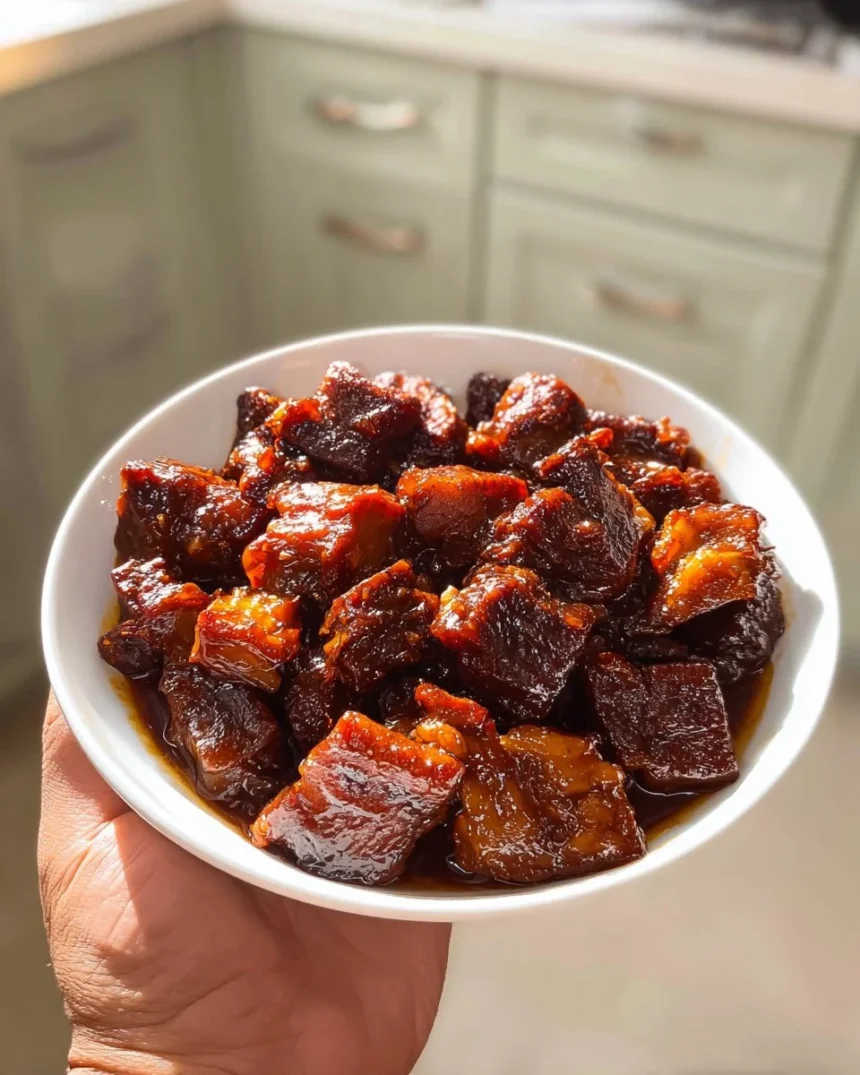 Honey soy glazed pork ribs freshly cooked and served on a plate.