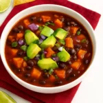 Bowl of 5-Ingredient Sweet Potato Black Bean Chili garnished with herbs