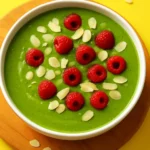 5-minute matcha green smoothie bowl topped with fruits and nuts