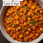 Cajun Spiced Orzo with Chickpeas garnished with herbs in a bowl.