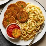 Crispy gluten-free eggplant parmesan served with marinara sauce