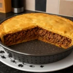 A delicious Desperate Dan Pie, showcasing its golden crust and hearty filling.