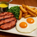 Delicious Gammon Egg Chips served with crispy fries and a sunny-side-up egg