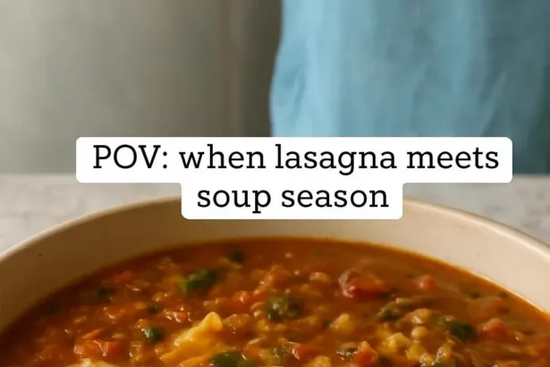 Bowl of Instant Pot Lasagna Soup topped with cheese and herbs