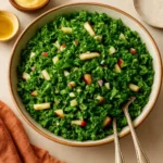 Bowl of fresh Kale Apple Slaw with green kale and red apple slices