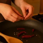 Bowl of Kung Pao Lentils garnished with peanuts and scallions